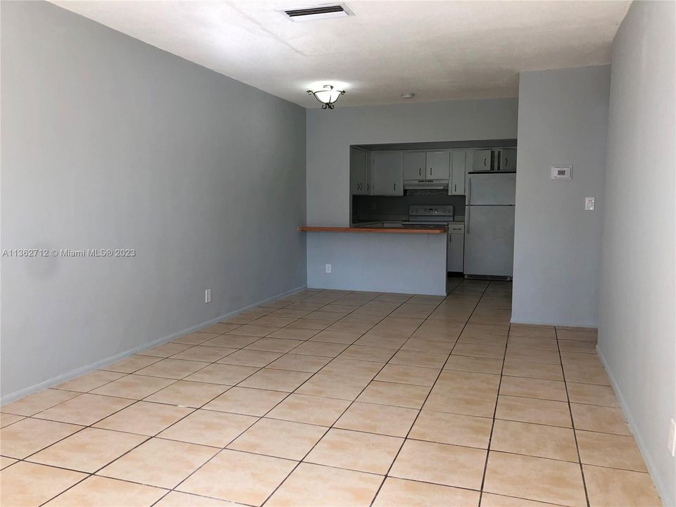 Living/Dining area with the kitchen at the back.