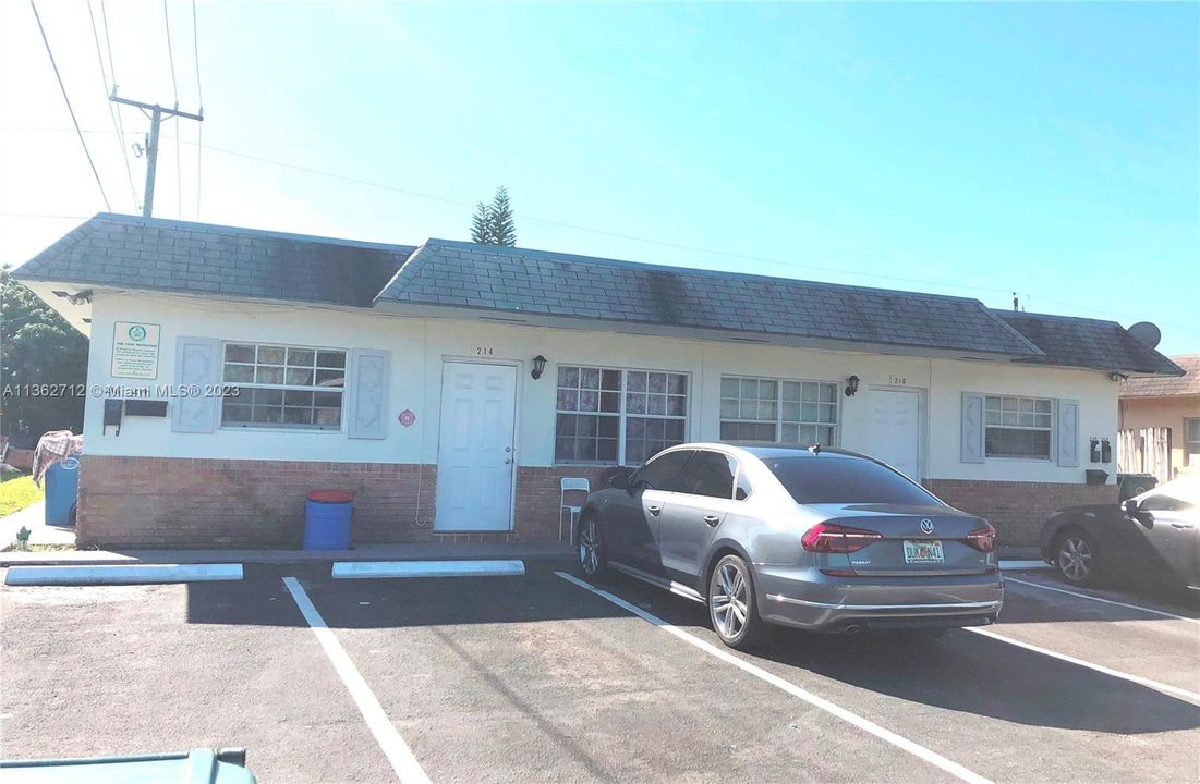 Go around the left side of the building and you'll find unit #216 in the back.