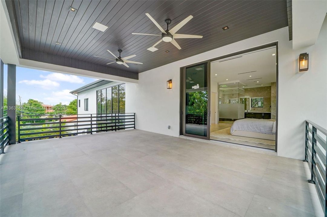 Second floor patio located off of the primary bedroom