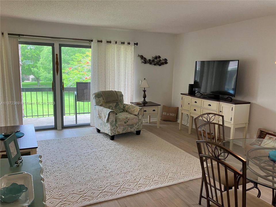 Living Dining area wood like flooring golf views