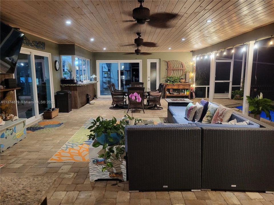 Tongue and grove ceiling with recess lights fans.