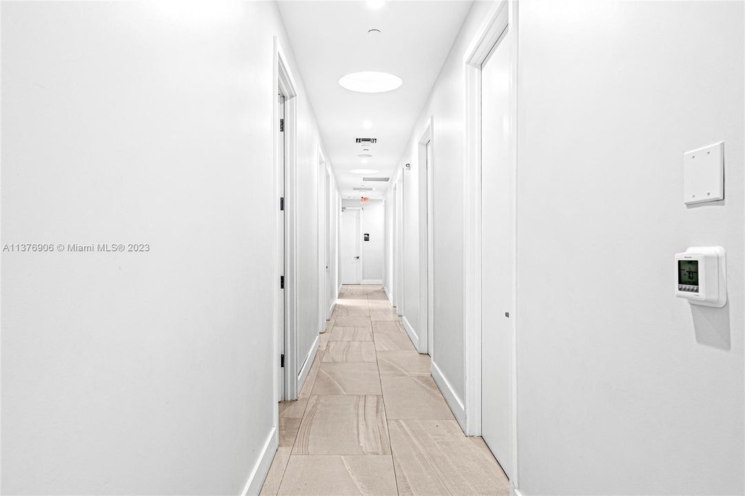 Hallway from reception desk.  Up to 16 internal smaller offices for medical or professional
