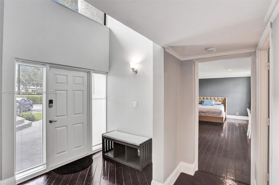 View to front door and Primary bedroom downstairs
