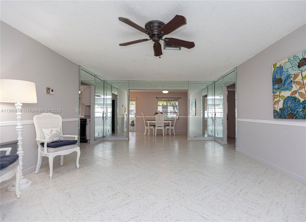 FROM LIVING TO DINING ROOM AREA. TILED FLOOR THROUGH-OUT THE HOUSE