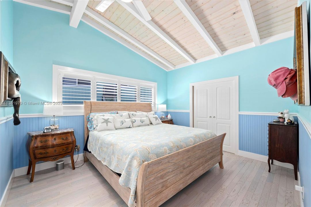 Master bedroom with vaulted ceilings.  The in-suite master bath is to the left and the double doors open to a delightfully spacious master walk in closet.  A real gem to this home.