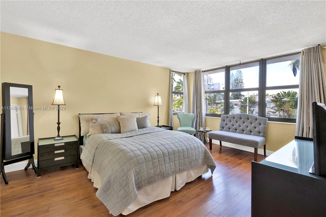Spacious Master Bedroom with Large Windows.