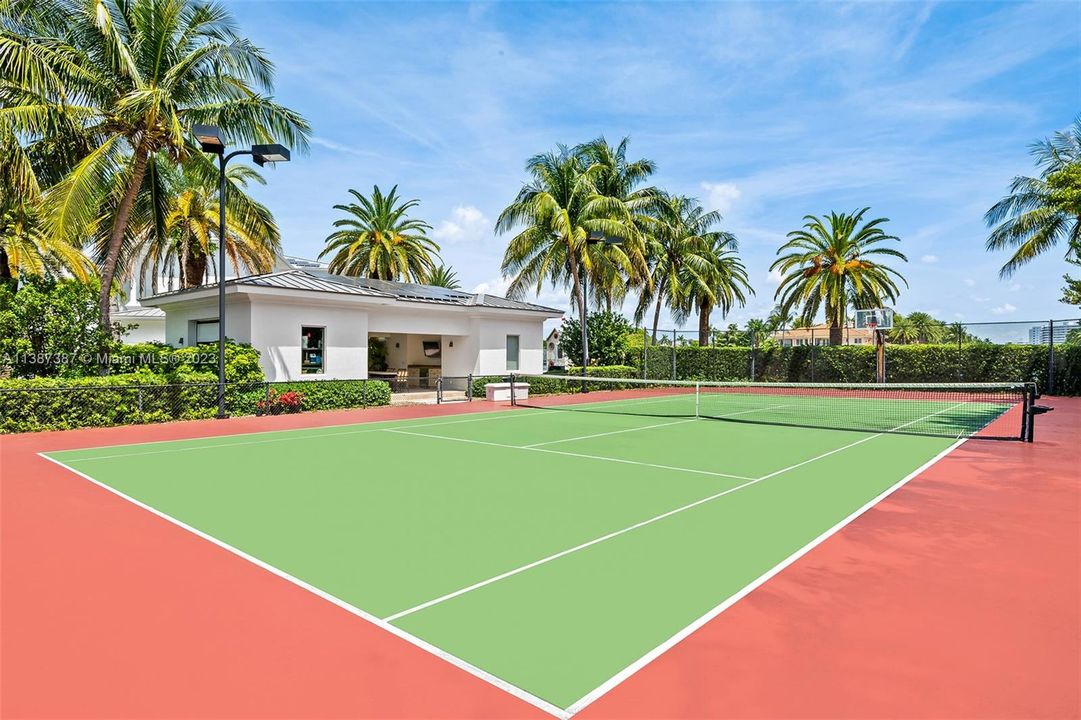 Tennis Court with Tennis Cabana.  Notice Basketball hoop on the north end.  There is also a batting cage on the south side of the tennis court.