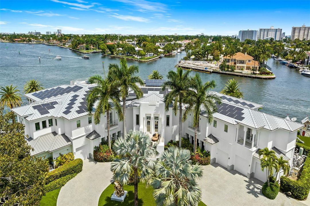 Aerial view showing intersection of Intracoastal waterway and New River.  Notice the solar panels which provide a major portion of energy for the home.