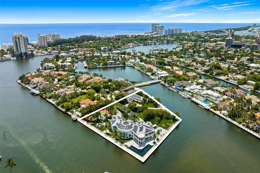 Outline of property with both houses, tennis court and garden.  2.7 acres of ocean access waterfront.  No fixed bridges.  Mega Yacht paradise.
