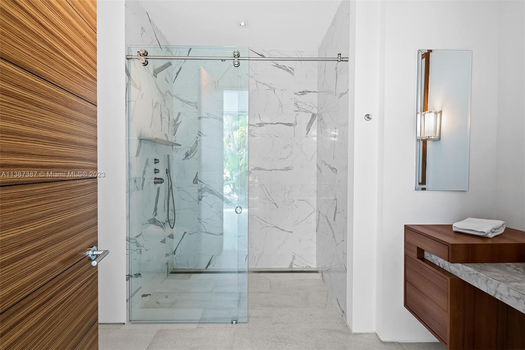 Bathroom with roll in shower.