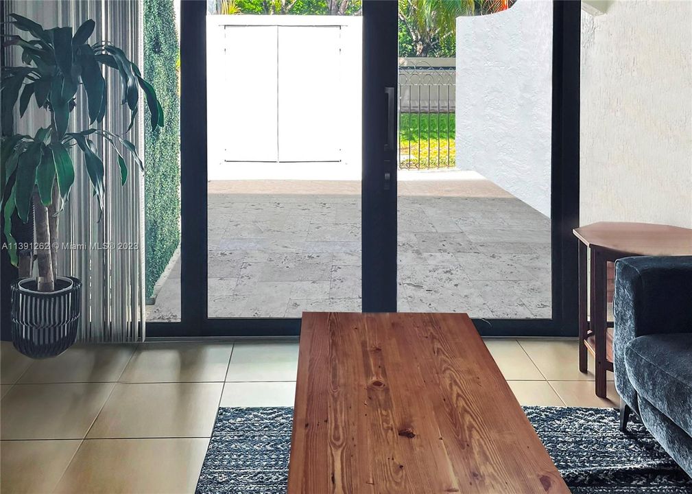 Spacious living room overlooking back patio