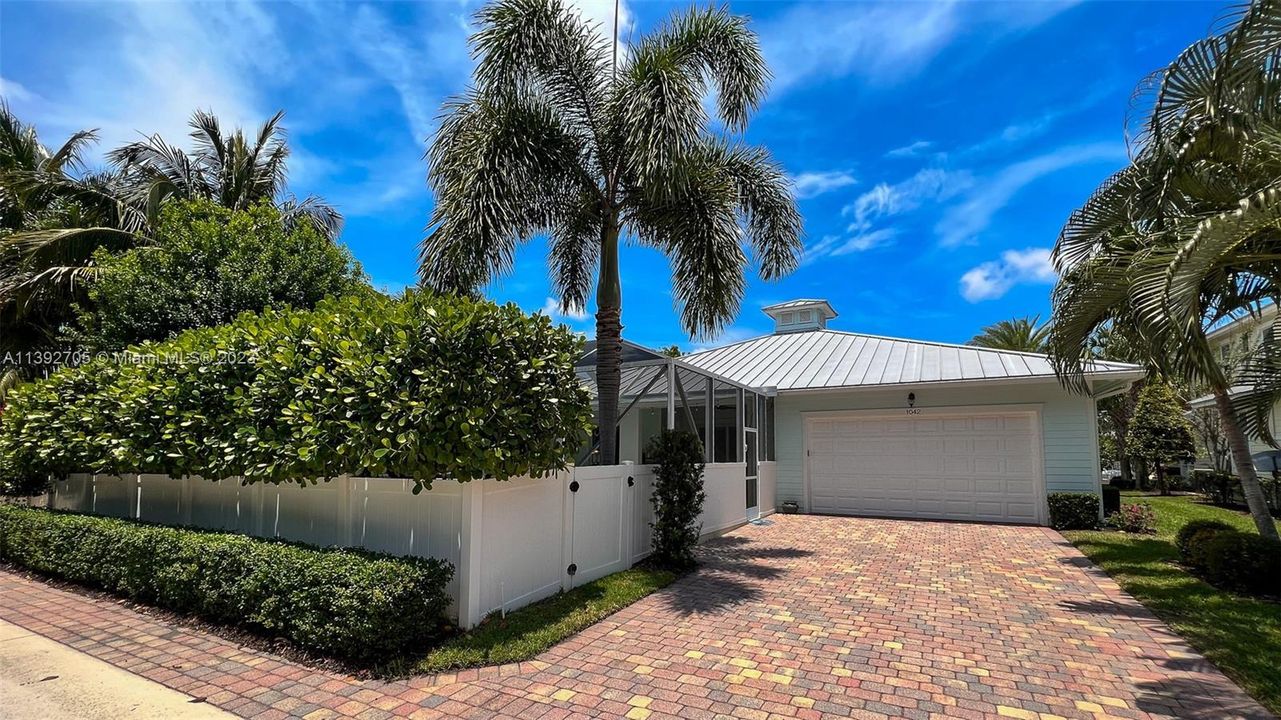 2 car garage with additional parking on driveway & in front of house