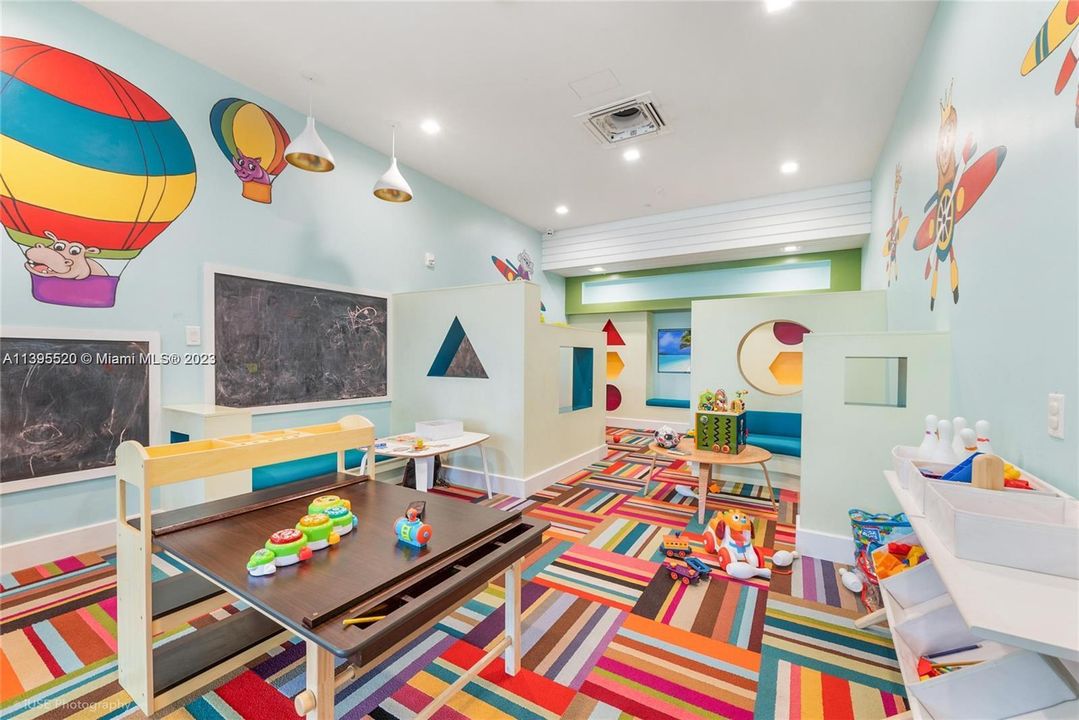 Children's playroom conveniently located in front of the gym's cardio area