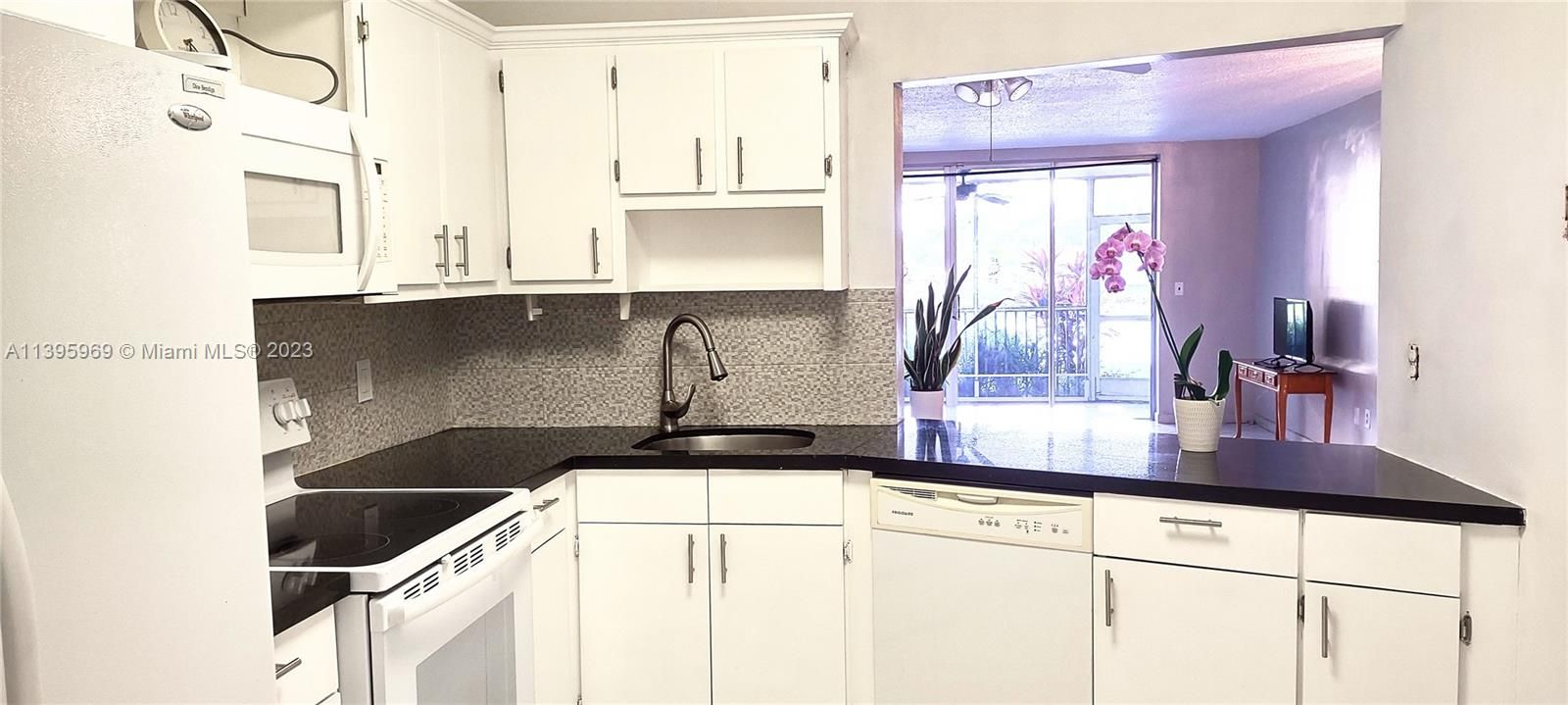 Open kitchen with granite countertop