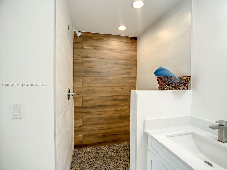 Primary spa-like bathroom with large shower.