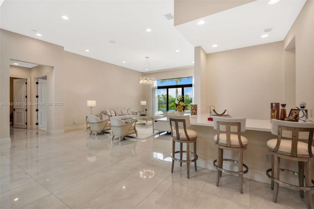 Oversized bar between formal living and dining area