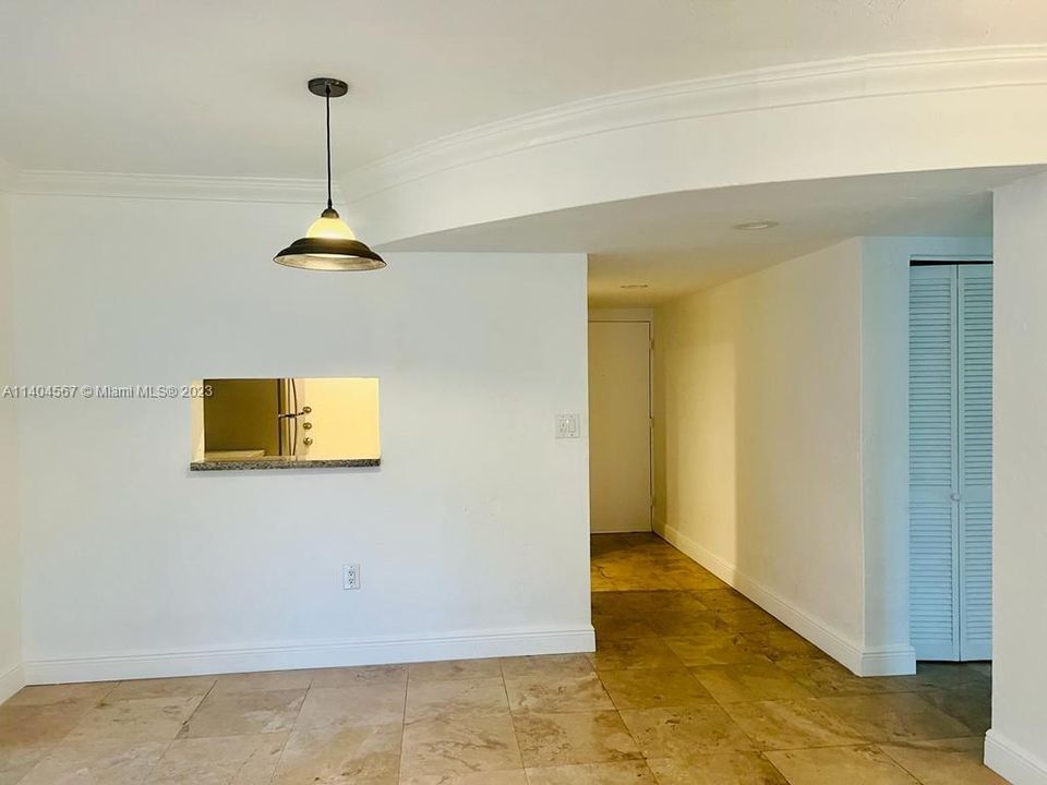Architectural arch defines foyer from living room