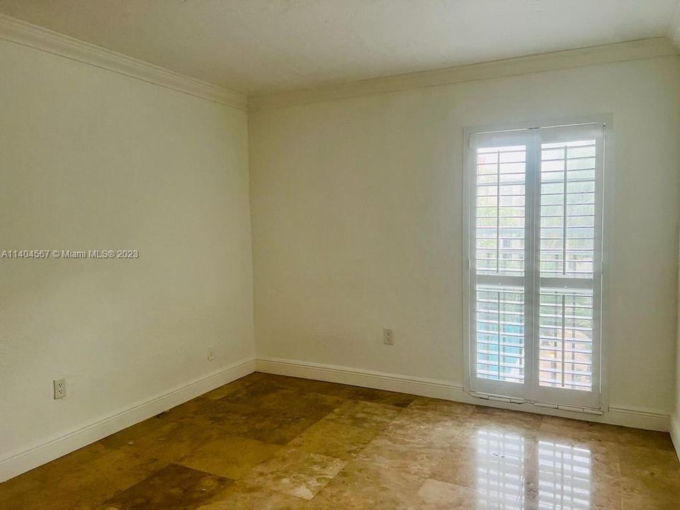 2nd bedroom with impact glass window