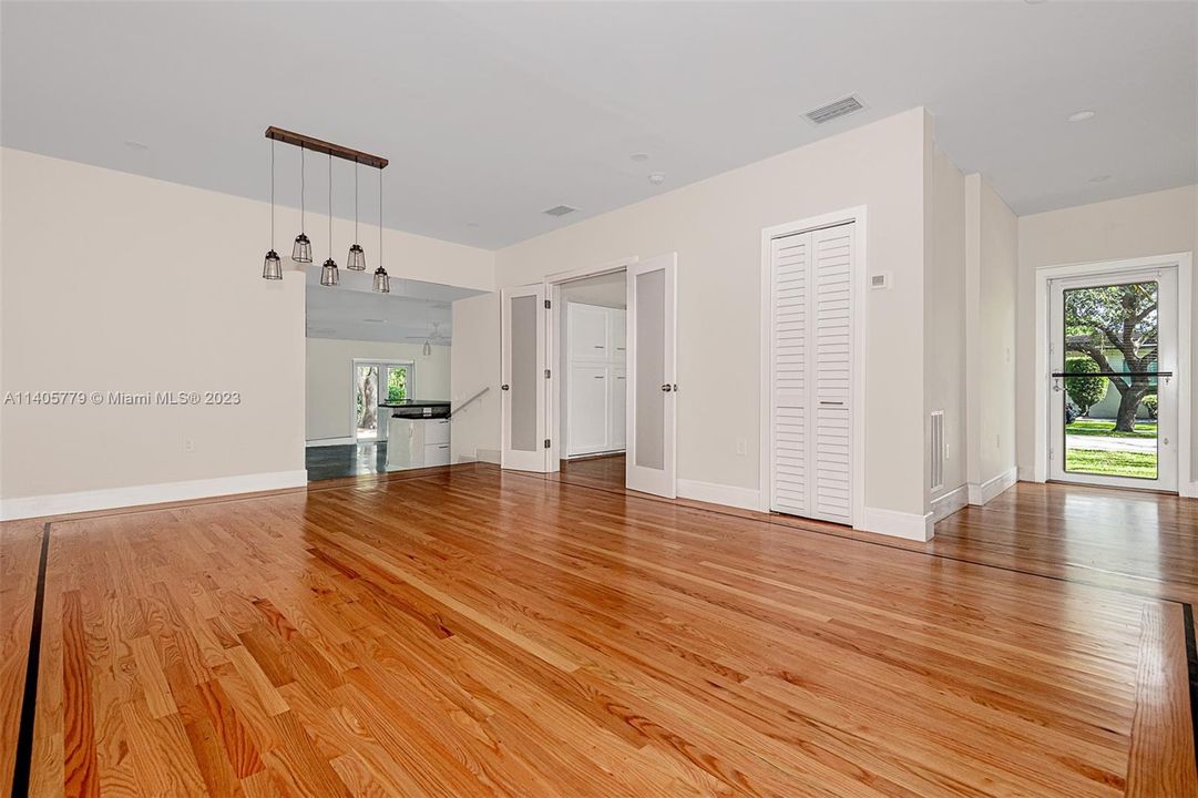 Refinished wood floors in the living room/dining room combination. There is a half bathroom located just inside the front door for guests or occupants.