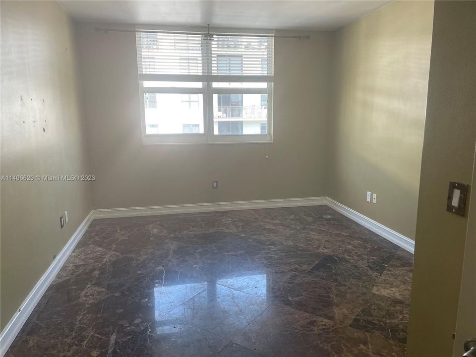 Bedroom #2 looking in. Nice flooring.