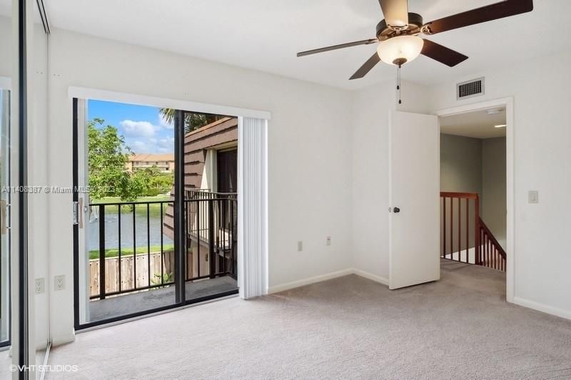 Guest bedroom with lake view on balcony