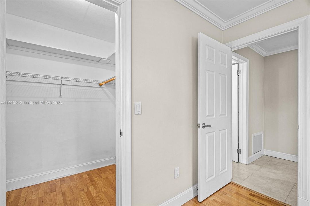 2nd bedroom featuring walk in closet