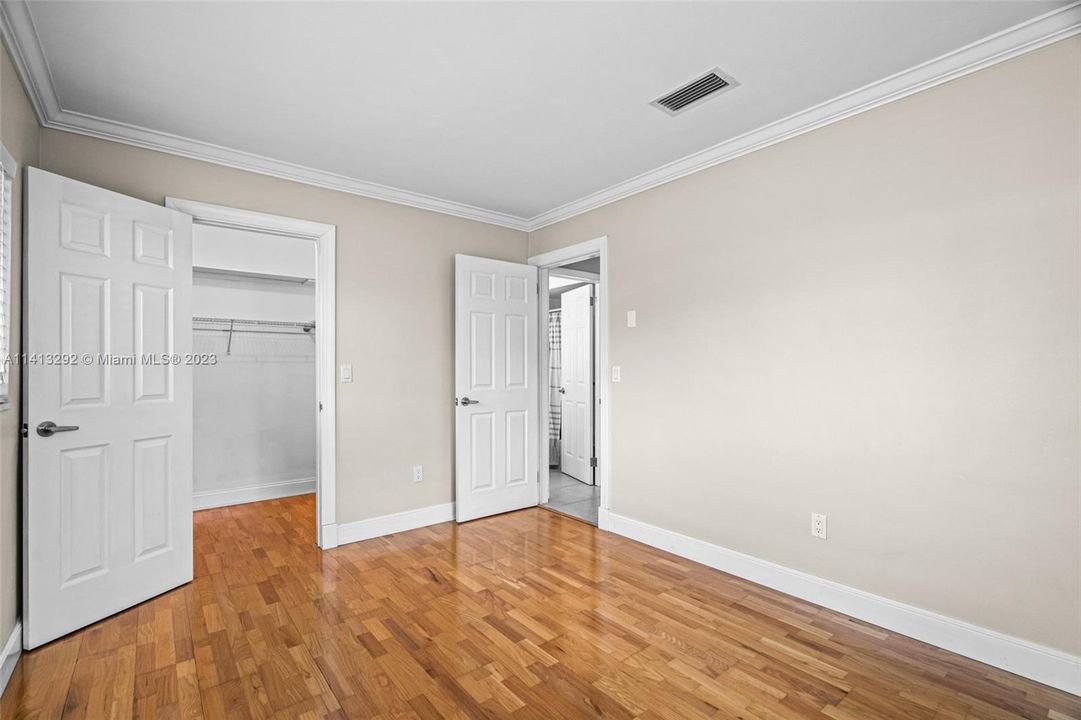 2nd bedroom featuring walk in closet