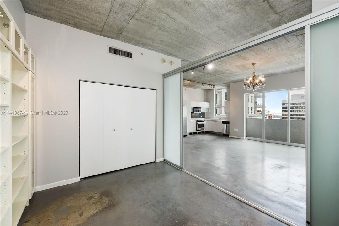 Second bedroom, with four panel frosted sliding doors open