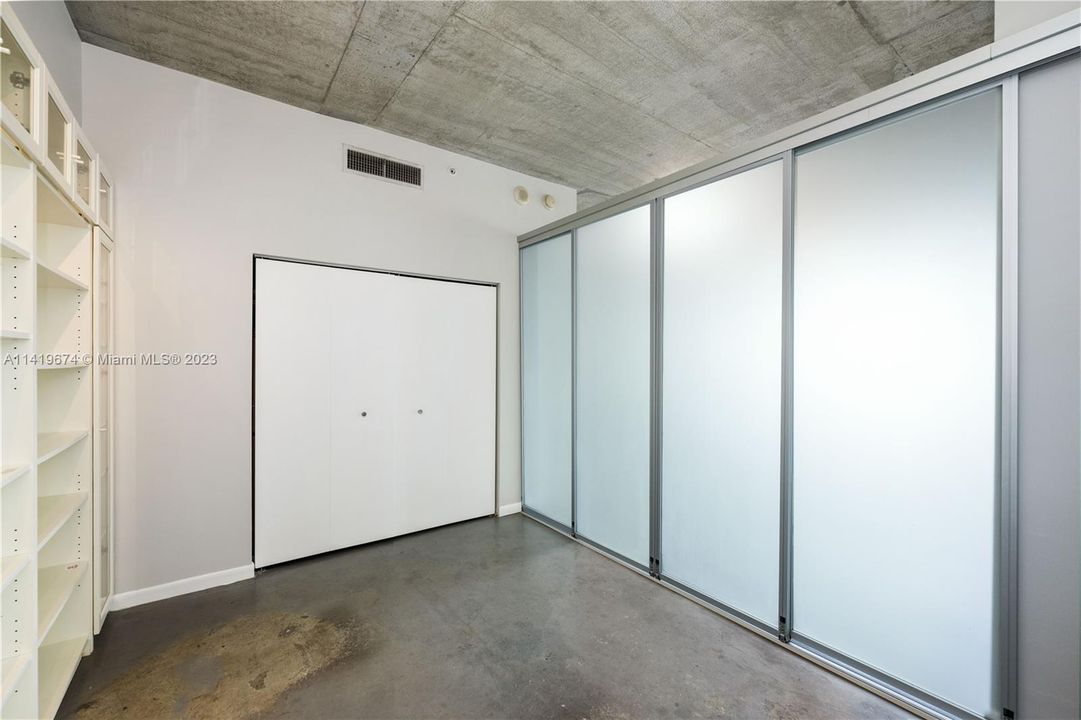 Second bedroom, with four panel frosted sliding doors closed