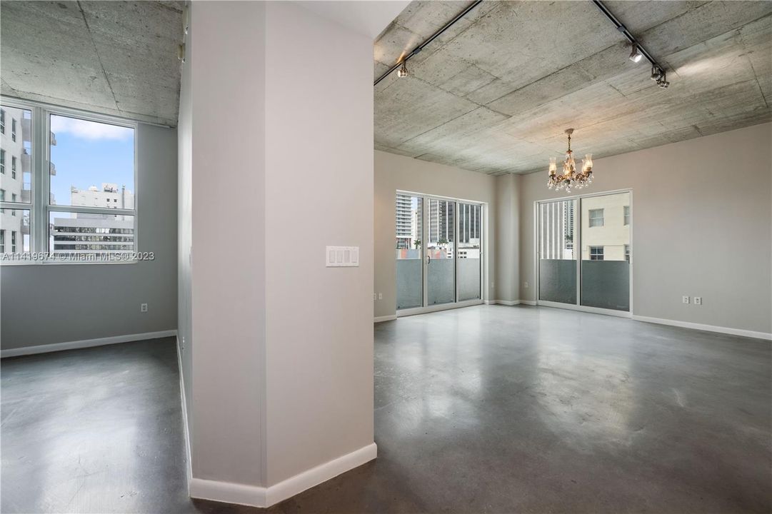 View from entry hallway, bedroom one on left (a door can be added) living room on right