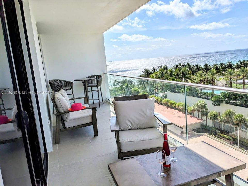 Enjoying a glass of wine in your balcony looking the ocean views