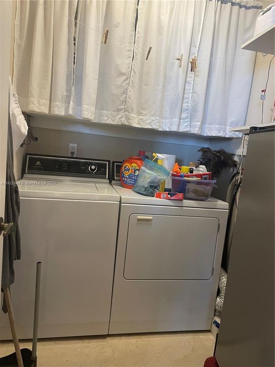 Full size  washer and dryer in the laundry room