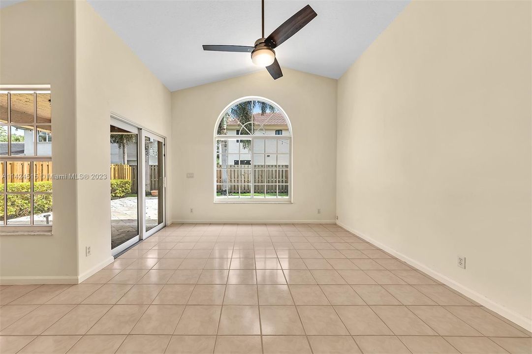 Family room and high ceiling with lots of natural light.