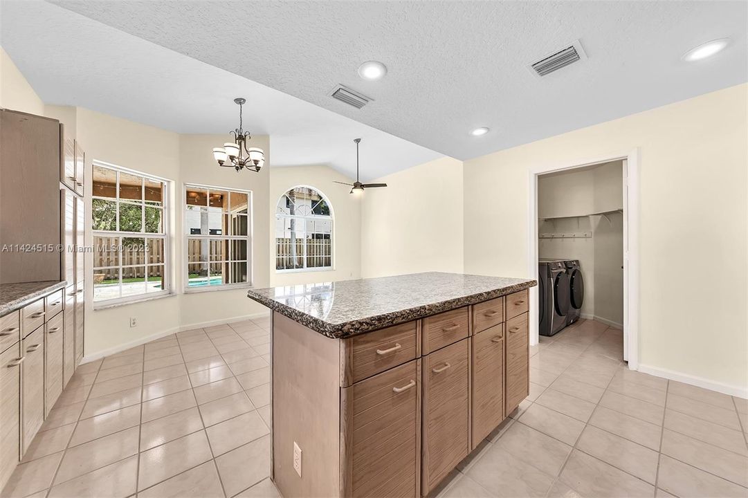 Kitchen view looking into eat-in area.