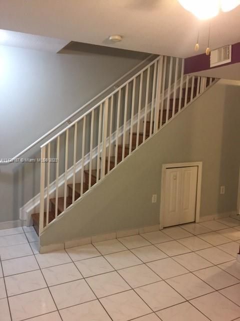 Stairs from similar unit with same square footage and layout only in reverse