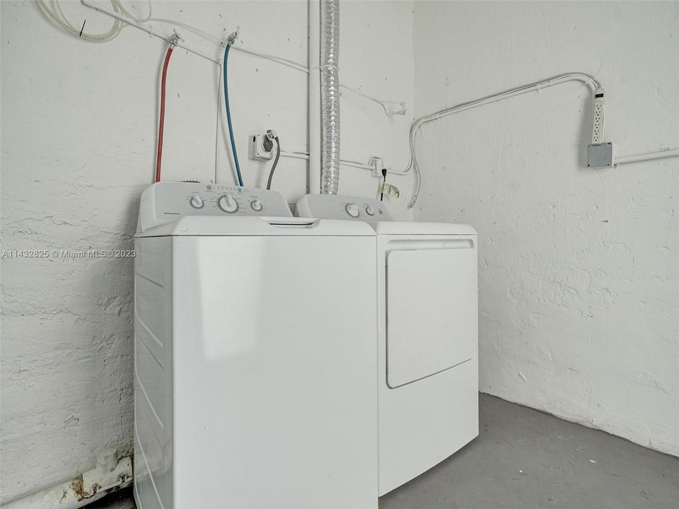 Unit 1152, laundry/storage with exit door.