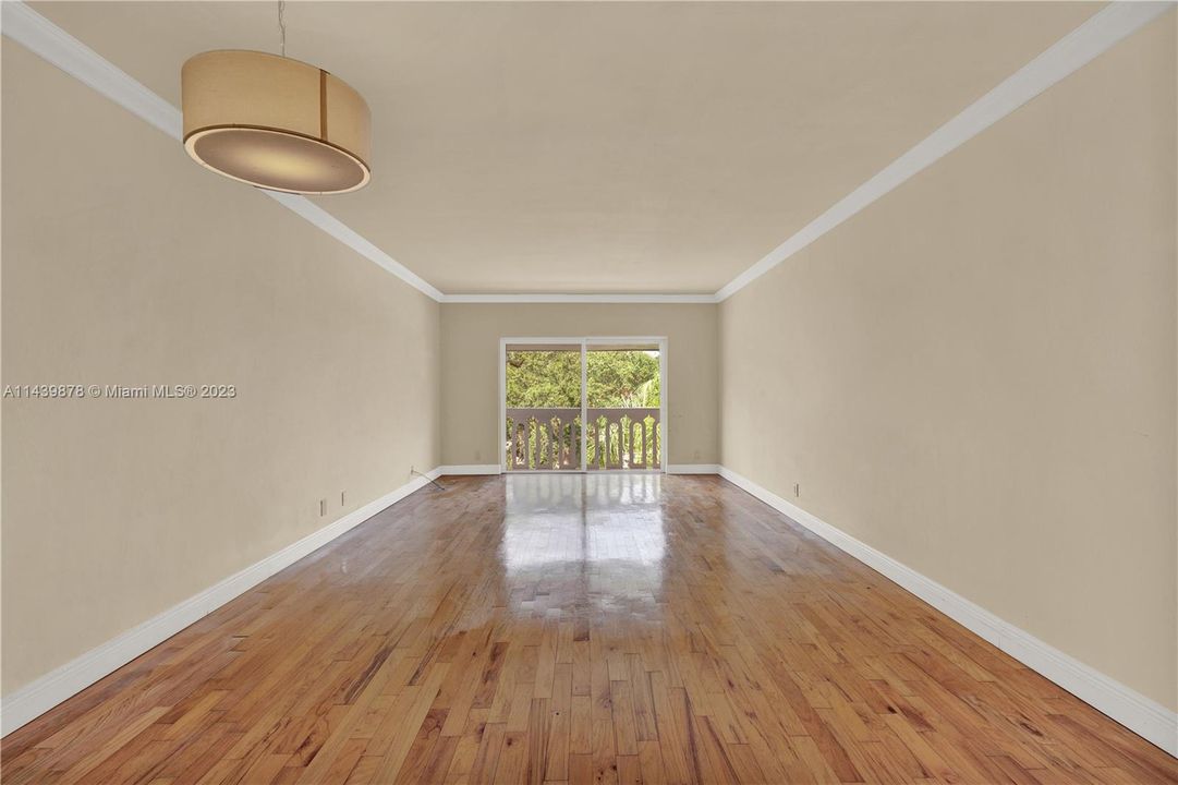 Dining area in the foreground, living room in the background