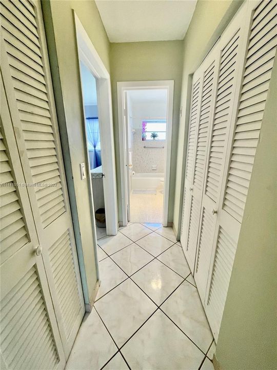 hallway to bathroom and bedroom