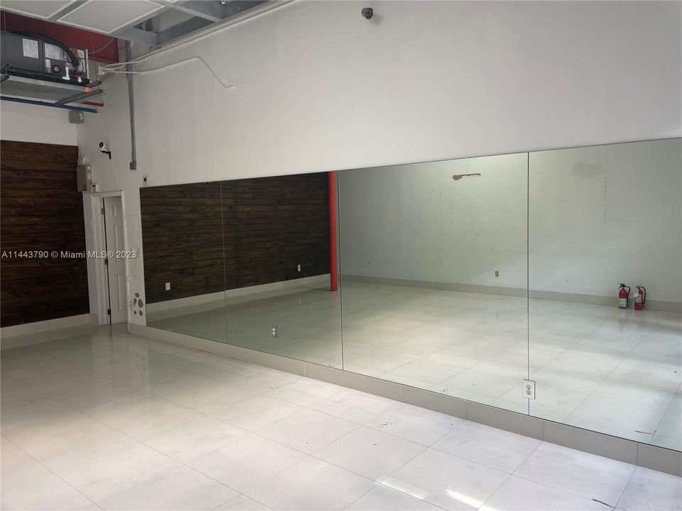 Existing Mirrors Installed Over Interior Wall of the Unit