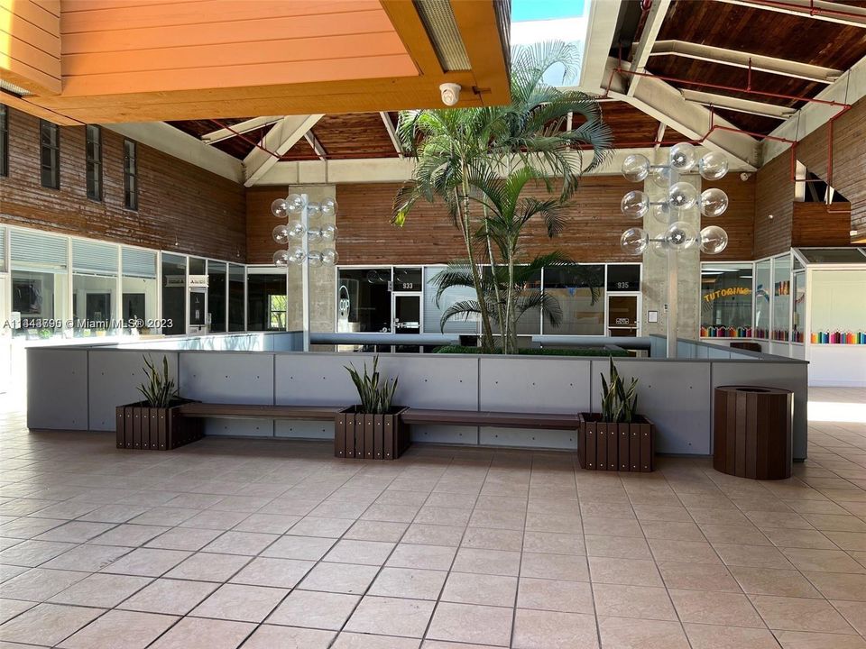 View of the Front Entrance of the Unit From a Hall of the Mall