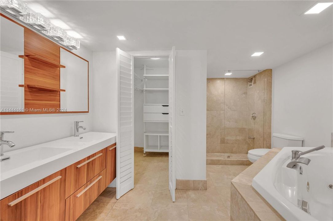 Master Bathroom, double vanity, walk-in closet with built in shelving