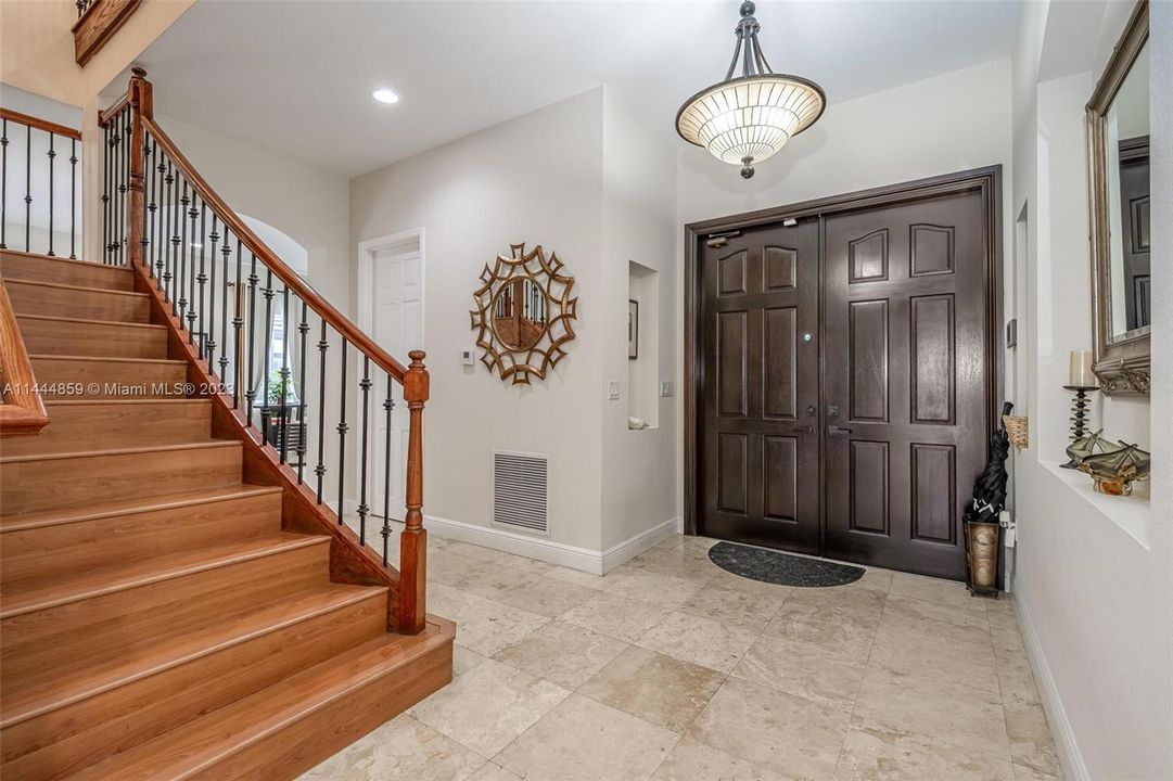 Wooden staircase leads to 2nd Floor