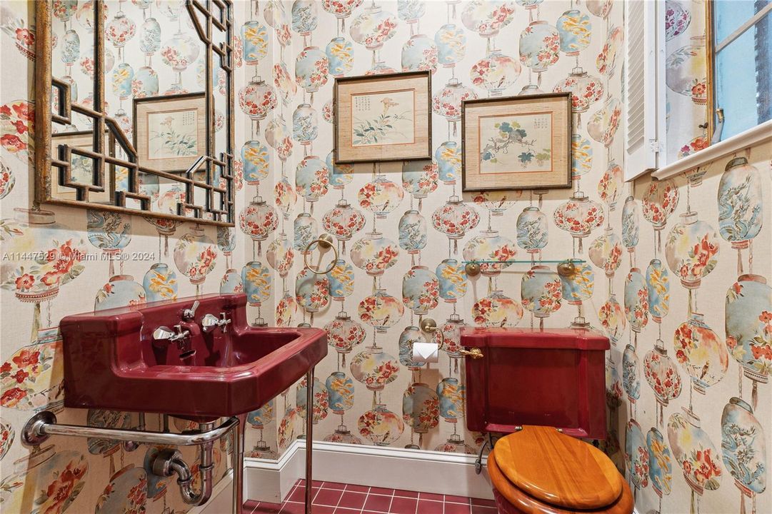 Vintage half bath for guests downstairs at foyer.