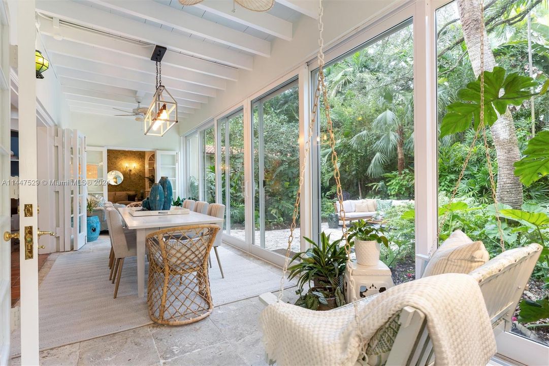 Dining area overlooks lush back gardens
