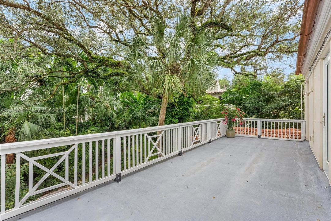 Primary bedroom deck facing back garden