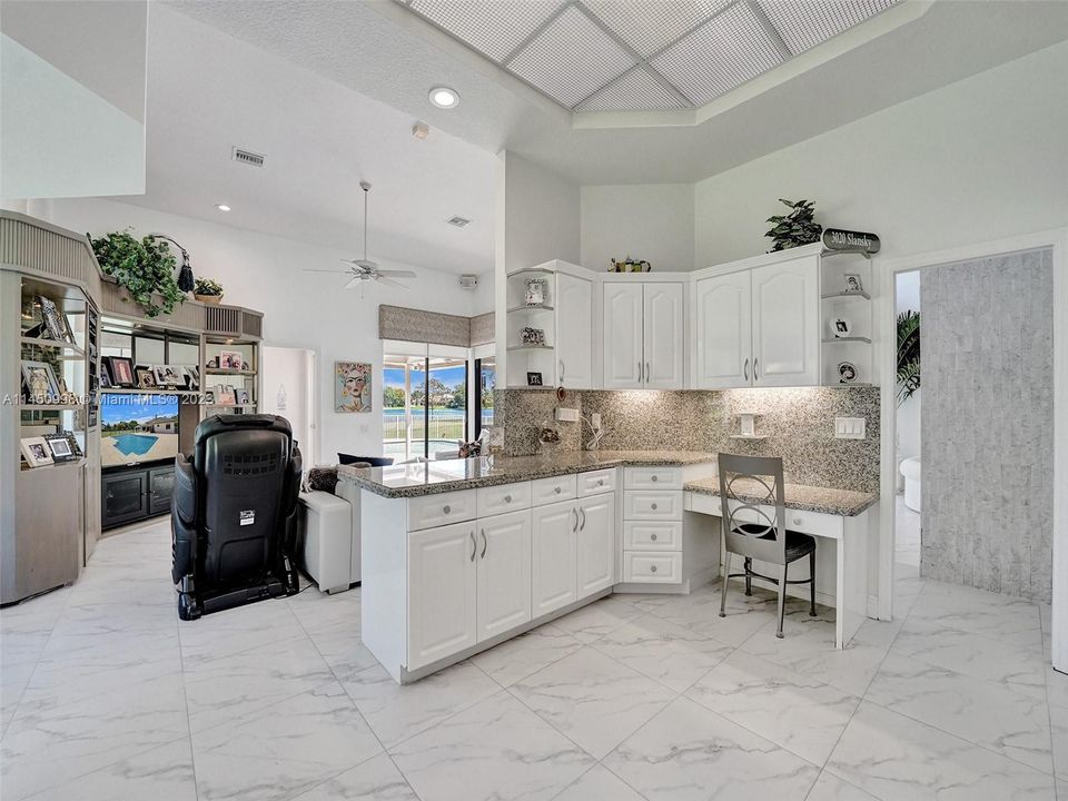 Family and bar area off the kitchen.....cook while watching tv too!