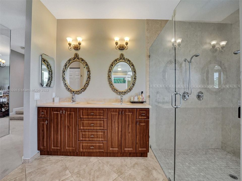 Relax in the tub after a long day in the office situated off of the primary bedroom and bathroom.