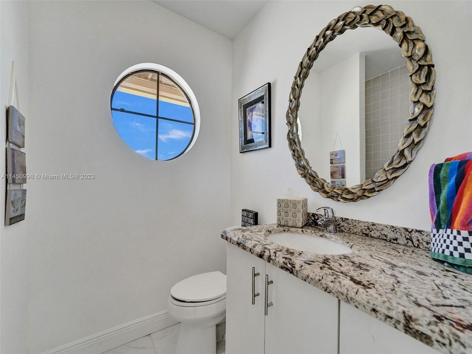 Huge laundry room with granite top and sink