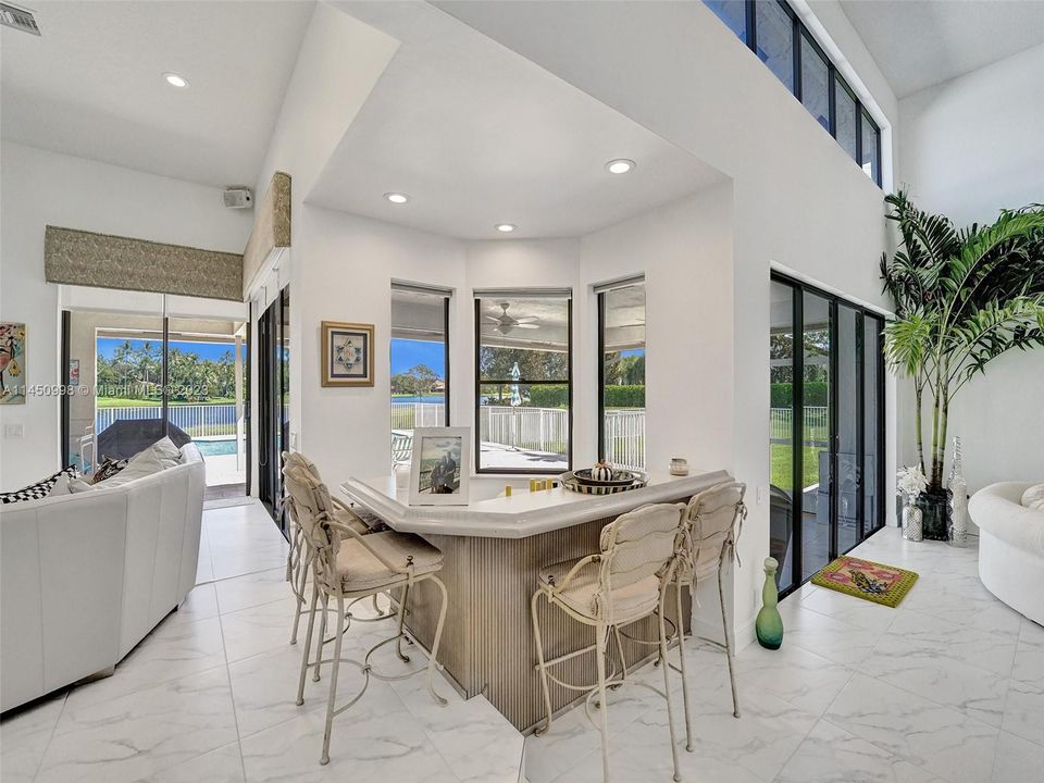Breakfast area off of the kitchen with LOTS of windows to bring in the sunshine and beauty of the day!