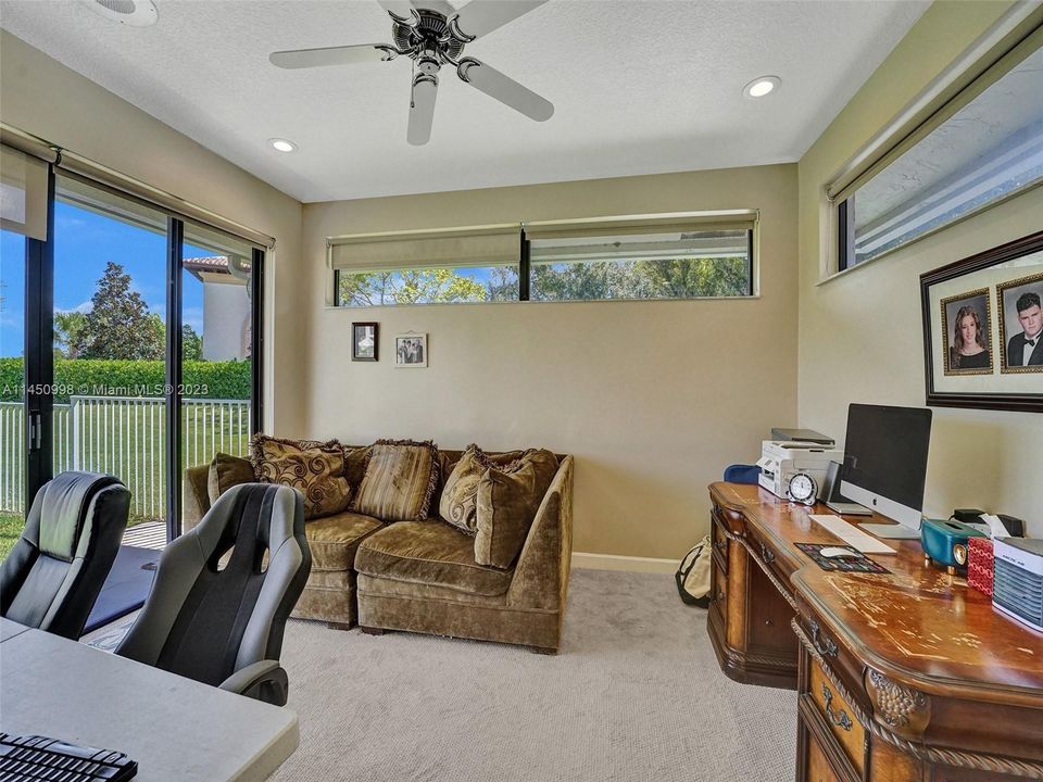 Newer bedroom carpet in this primary bedroom, which has easy access that leads to the backyard and pool.